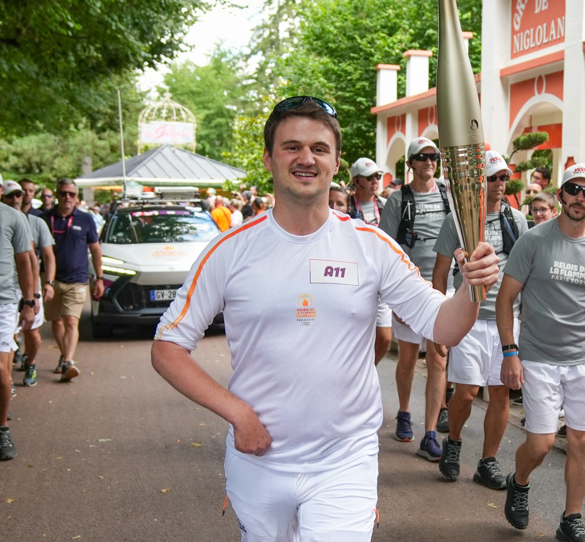 Louis Gustin carrying the Olympic Torch