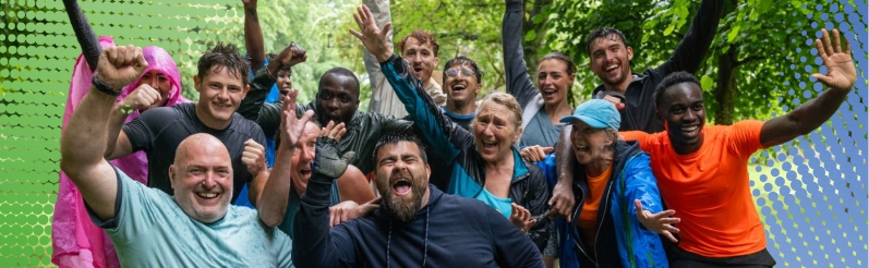 Group of people smiling and cheering.