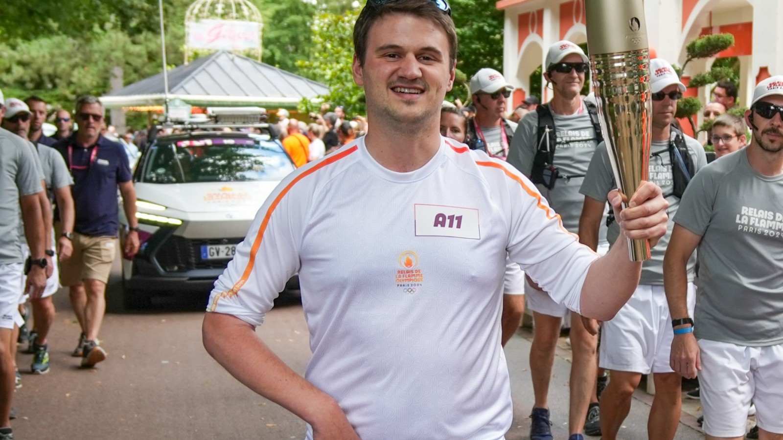 Louis Gustin carrying the Olympic Torch